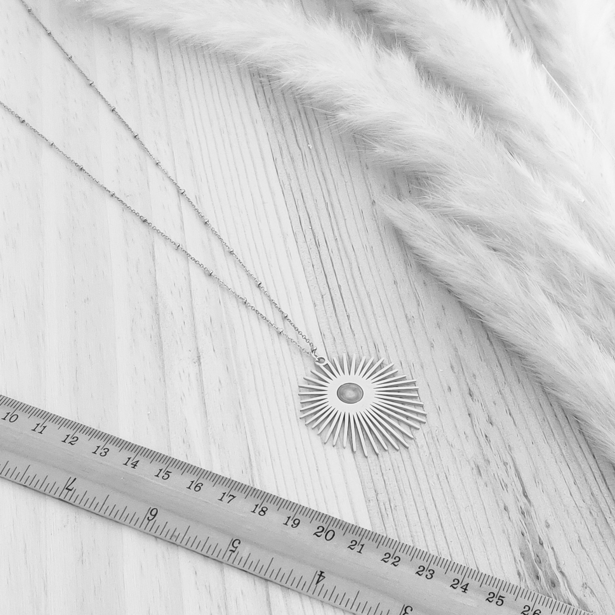 collier hélios règle copie